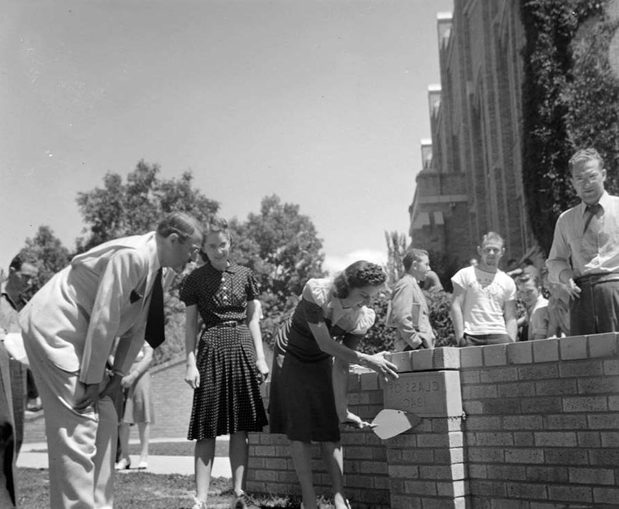 Student adding plaque on the Hi Bridge